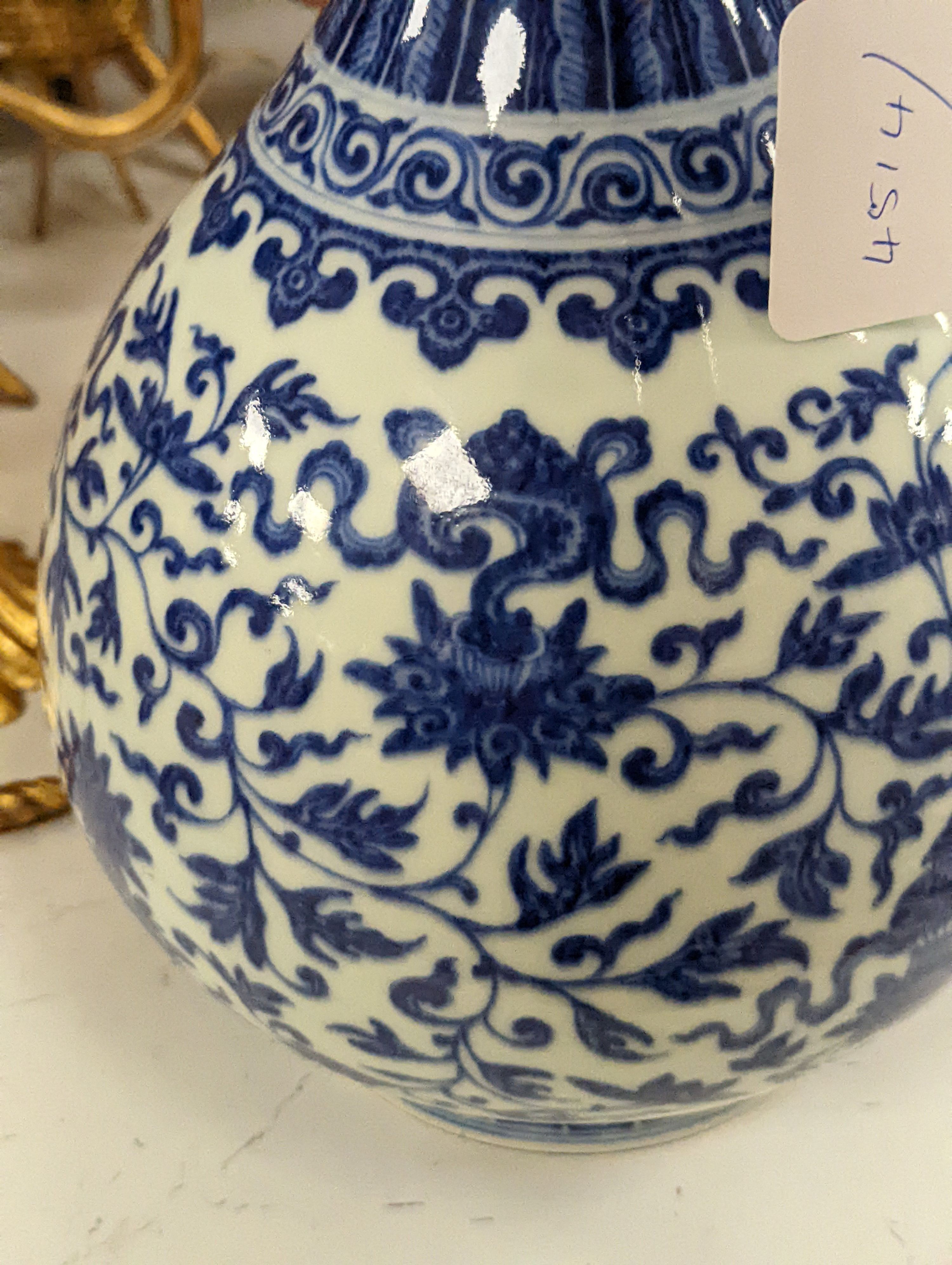 A Chinese blue and white Ming style 'lotus' vase, Yuhuchunping, Qianlong seal mark but 19th century - 28cm high